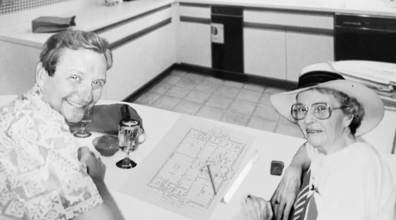 Tom MacDonald and his mother reviewing the building plans for Carlton Senior Living's first community in Pleasant Hill, California